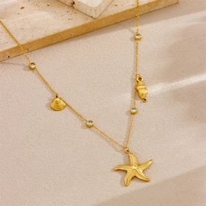 Gold plated stainless steel necklace with starfish, seashell, and clear crystal pendants