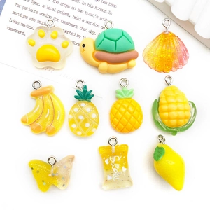 Assorted colorful resin DIY charms including fruit and candy shapes with metal loops