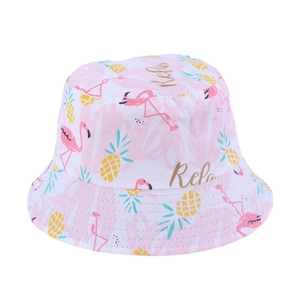 Detail showing tropical flamingo and pineapple print with Relax text on a bucket hat