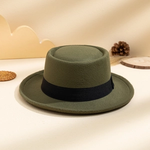 Detailed texture of army green wool felt boater hat with black ribbon decoration