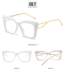 Detail view of cat-eye glasses with white frame and gold geometric hollow temples