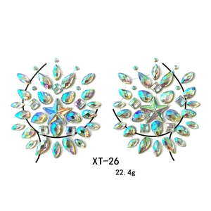 Detailed view of iridescent star-shaped rhinestone breast jewels for party festivals