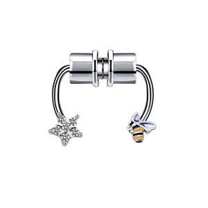 Detail view of silver magnetic nose ring featuring a crystal star and bee charm element