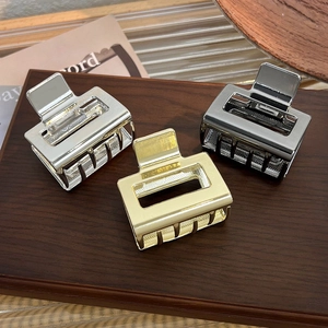 Three-piece metal hair claw clips in gold silver and black with hollow rectangle design