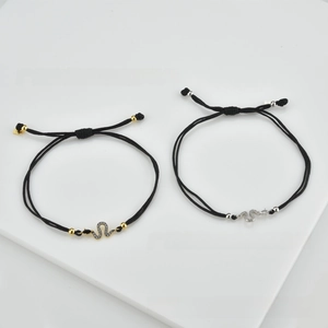Detail of adjustable black woven bracelets with S925 silver snake-link zircon charms