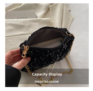 Macro shot showing internal storage capacity and gold chain of black sequin bag
