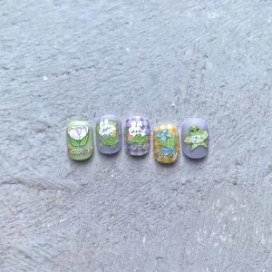 5D embossed nail stickers featuring hand-painted rabbit and floral designs on a stone background