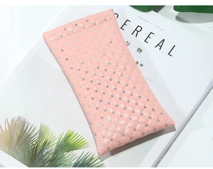 Pink quilted PU leather sunglasses pouch with rhinestones on a Cereal magazine