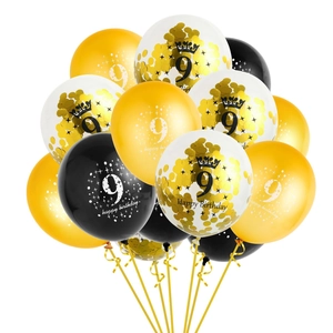 Detail of gold and black number 9 balloons with confetti and Happy Birthday print