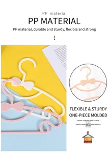 Detailed view of plastic bow-knot baby hangers with non-slip finish and durable PP material