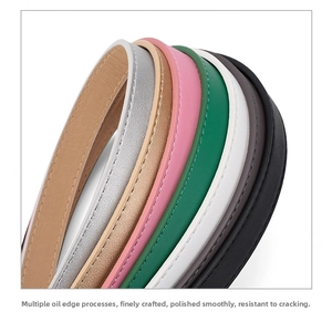 Macro detail of multi-color leather thin belts showcasing premium edge paint and stitching