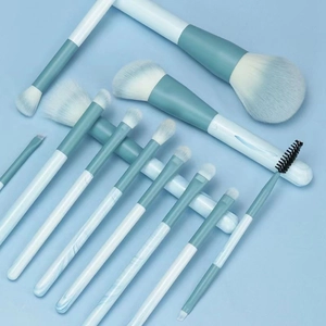 Set of 12 soft makeup brushes with marble handles and teal gradient bristles