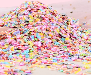 Close-up of colorful fruit polymer clay slices for DIY crafts and nail art decoration