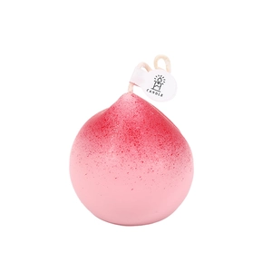 Realistic peach-shaped scented candle with pink gradient and frosted wax texture