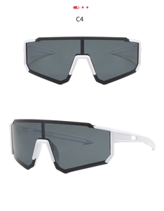 Detail of sports sunglasses with black and white frame and large smoke grey lens