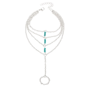 Silver multi-layer slave bracelet with turquoise beads and finger ring chain detail