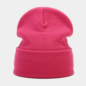 Macro detail of high-quality magenta ribbed knit beanie with soft textured fabric