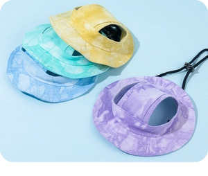 Detail of colorful tie-dye canvas pet sun hats with ear holes and adjustable drawstrings