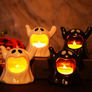 Ceramic Halloween ghost candle holders with warm LED lights in black and white
