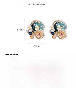Detailed view of blue crystal flower earrings with 2.7cm size dimensions and materials