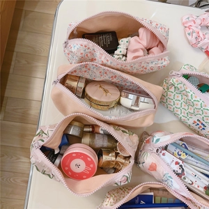 Floral cotton pouch organizers showing large capacity for cosmetics and stationery