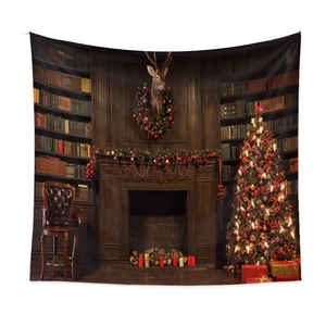 Close-up of Christmas tapestry featuring a fireplace and tree on a white wall