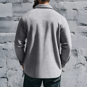 Rear view of a men's slim fit winter jacket in light grey knit fabric on a model