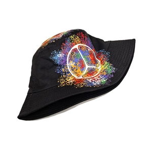 Close-up of Peace & Love slogan and colorful splatter print on black cotton bucket hat