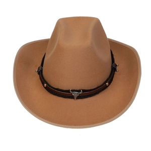 Close-up of brown wool western cowboy hat with metal bull head buckle and studs