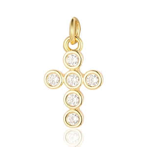 Detailed view of a gold-plated cross pendant with clear cubic zirconia on white background