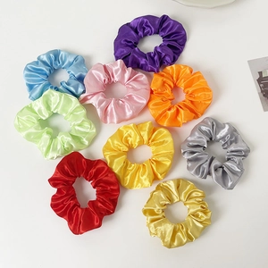 Colorful LED glowing satin hair scrunchies in 9 vibrant colors on a white background