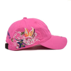 Close-up of colorful butterfly embroidery and metal buckle on rose pink baseball cap