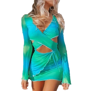 Detail of teal gradient cut-out knit mini dress showing waist and neckline design