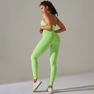 Detail of lime green seamless yoga set with halter bra and high waist leggings for fitness