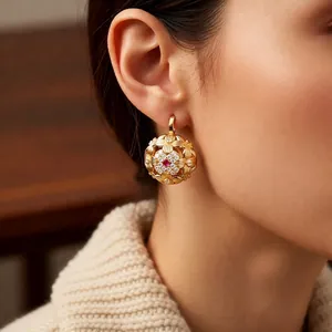 Vintage gold hollow flower pendant earrings with red center stone and white crystals