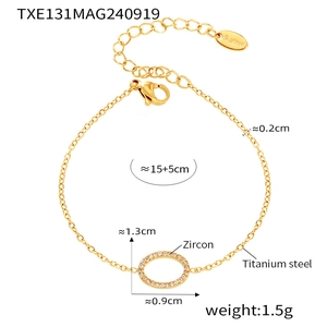 Detailed view of 18k gold plated titanium steel bracelet with zircon oval pendant