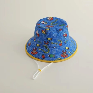 Detailed top view of children's blue sun hat with cartoon animals and yellow brim trim
