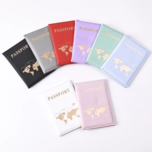 Detail view of colorful PU leather passport covers with gold stamped world map designs