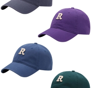 Detail of soft top baseball caps in purple, blue, green, and grey with R letter embroidery