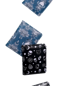 Detailed view of skull print wallets featuring gothic patterns and zip closure