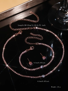 Detail view of rose gold necklace and stud earrings set with crystal size specifications
