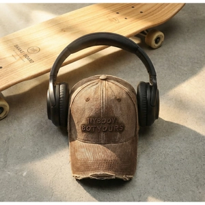 Close-up of vintage washed baseball cap with 3D embroidery and distressed brim details