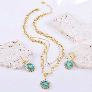 Gold-plated turquoise sun layered necklace and earrings set with pearl accent