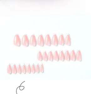 Flat lay of 24 pieces almond-shaped light pink press on nails with white French tips