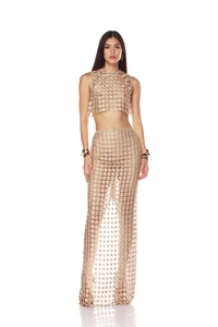 Detail of gold crochet knit two-piece set featuring sheer fishtail skirt texture