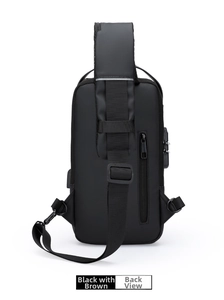 Detail view of anti-theft back pocket and lock on a waterproof black chest bag