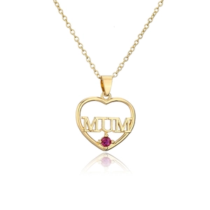 Close-up of gold heart MOM pendant with zircon setting and red gemstone detail