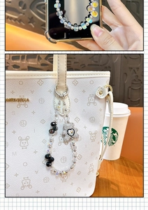 Close-up of beaded phone charm with rhinestone bear and heart hanging on a bag