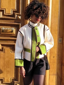 Chic quilted jacket with green color-block trim and vertical stripe texture detail