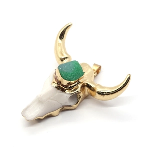 Natural stone bull head pendant with gold plating and green crystal in 47x47mm size